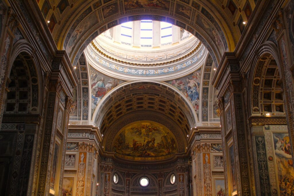 a large ornate ceiling with paintings