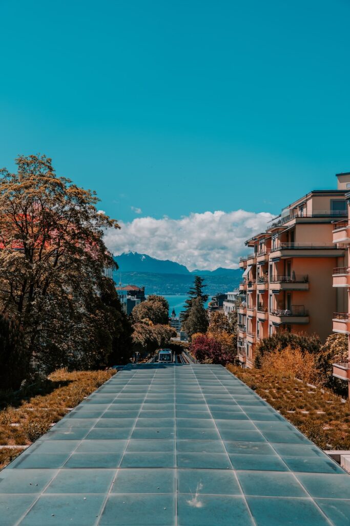 an empty walkway in front of a building