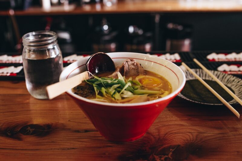 pho soup beside chopsticks 