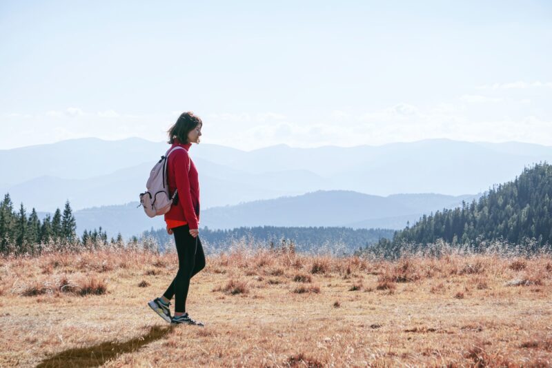 a lady walking in a field. Comfortable Walking Shoes for Women