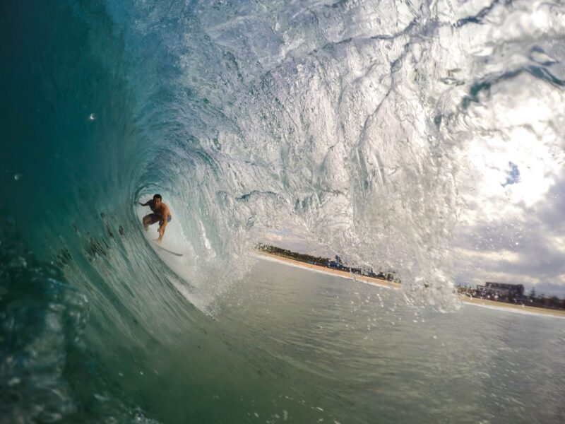 man surfing during daytime - best destinations for surfers