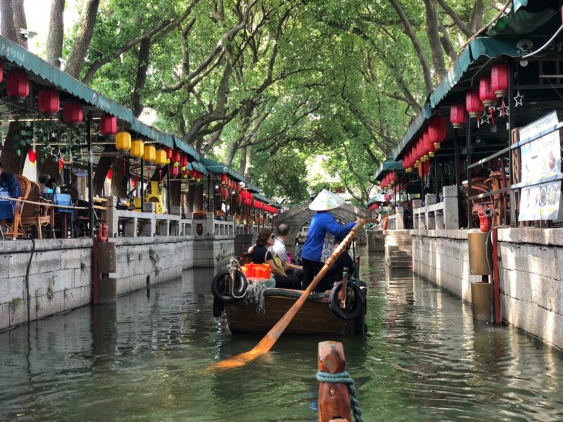 a person riding a boat down a river