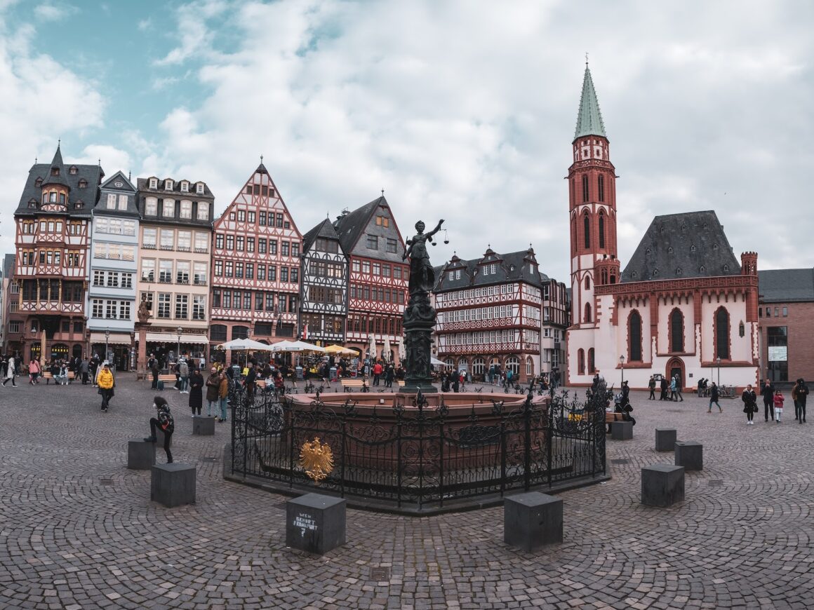 a group of buildings with people walking around