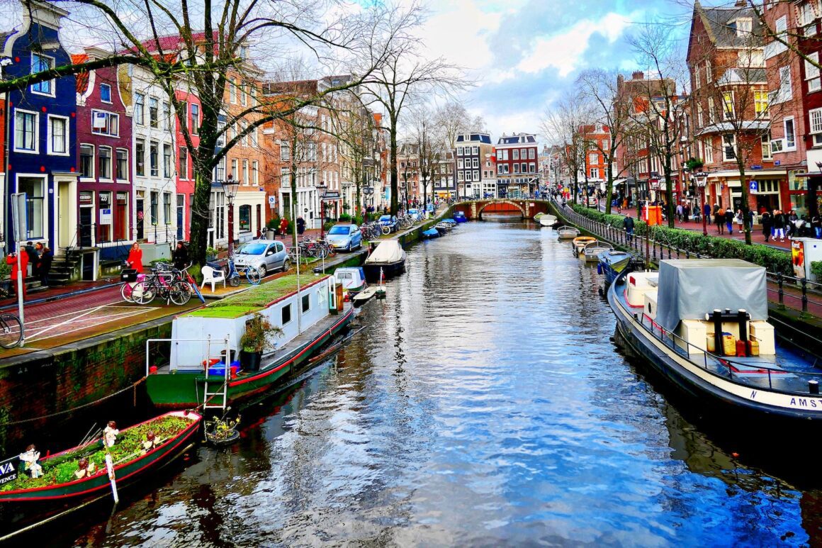 boat on river near buildings during daytime