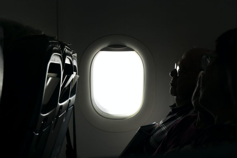 man sleeping on a plane