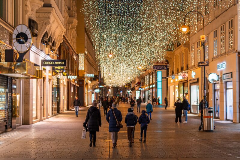 people walking on street during night time