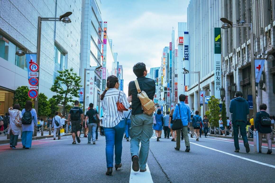 people walking on asphalt road