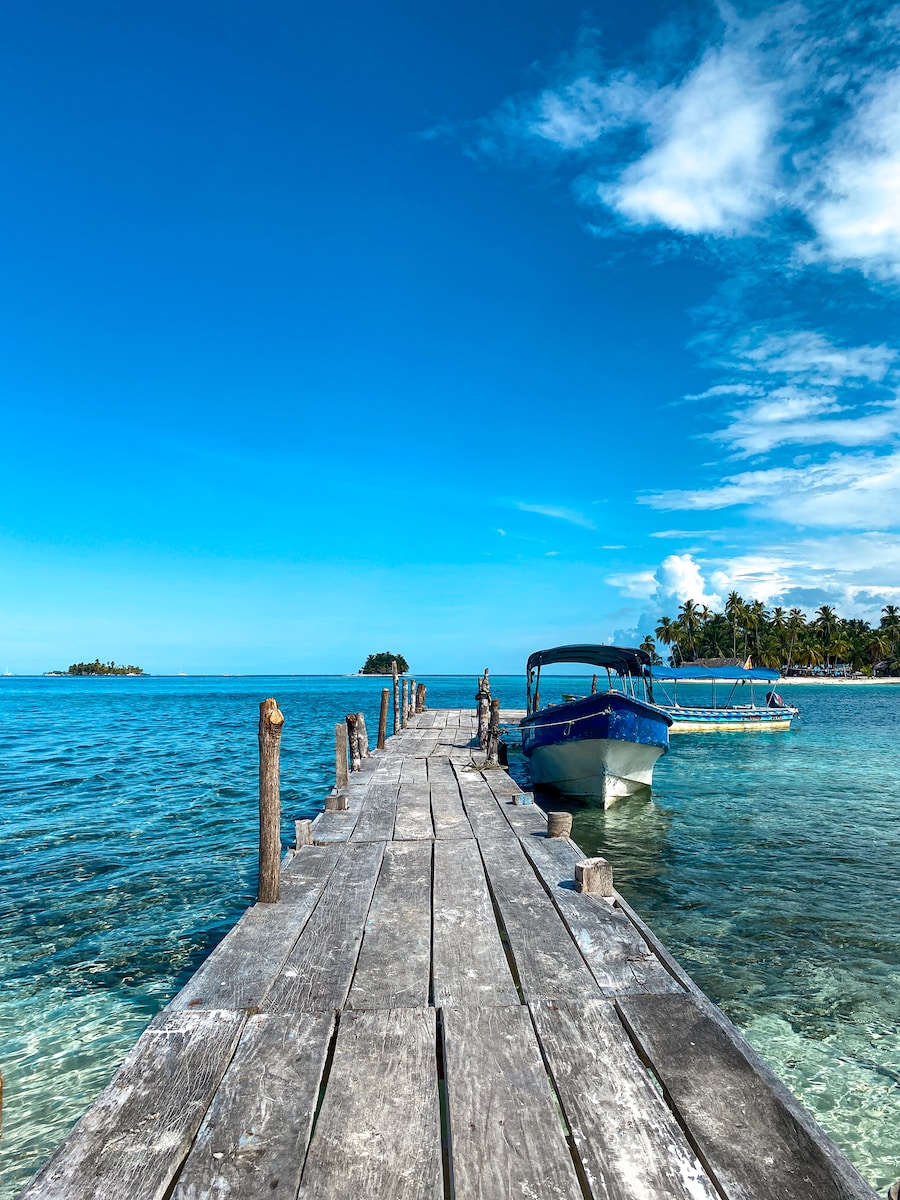 a dock leading to a boat