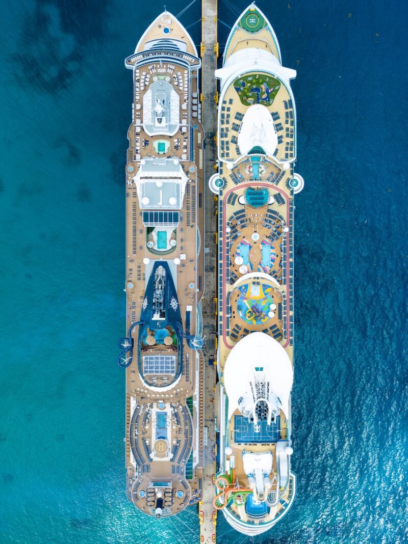 two brown cruise ships on body of water