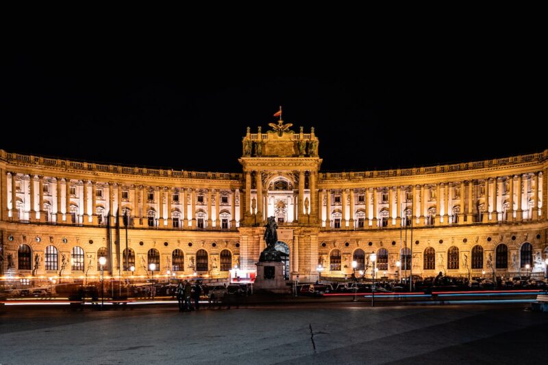 a large building lit up at night time