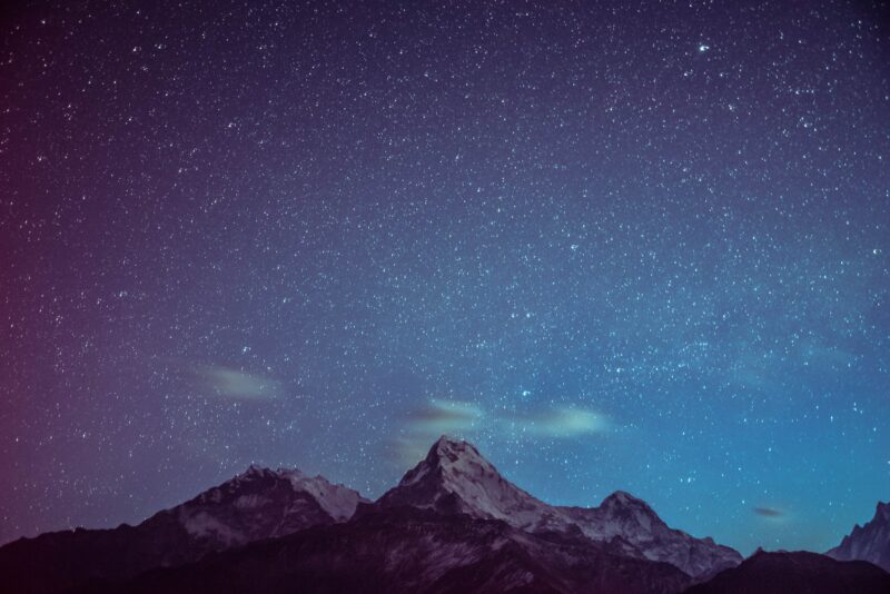 icy mountains under starry night stargazing