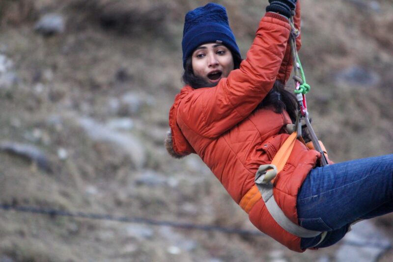 a lady ziplining 