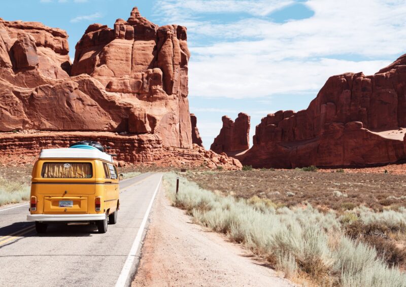 yellow Volkswagen van on road Road Trip Ideas