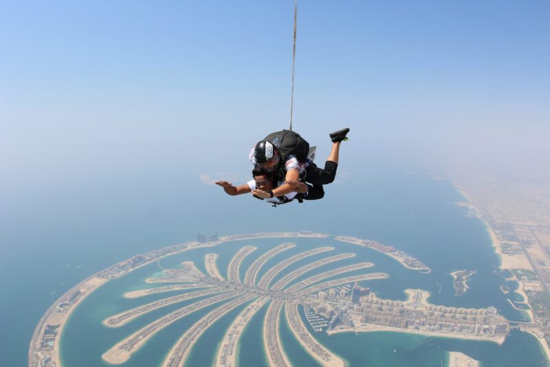 two people skydiving over Dubai