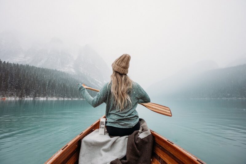 woman canoeing in cold weather 