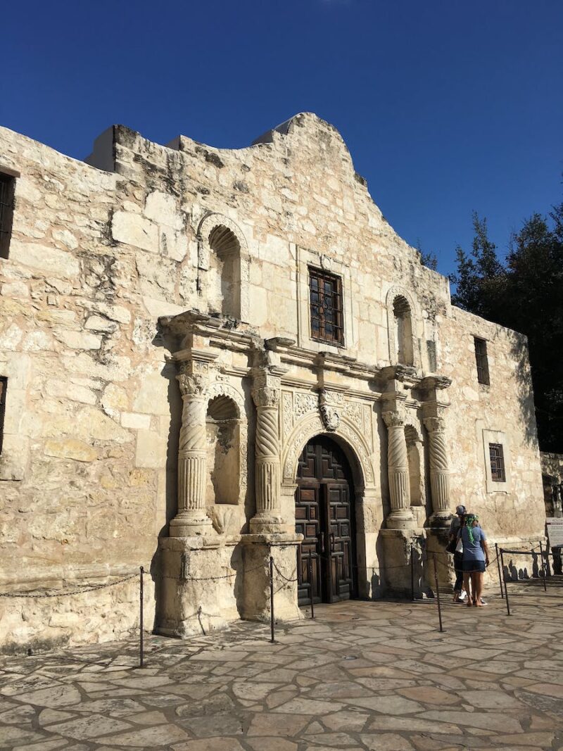 Facade of ancient Roman Catholic church on sunny day