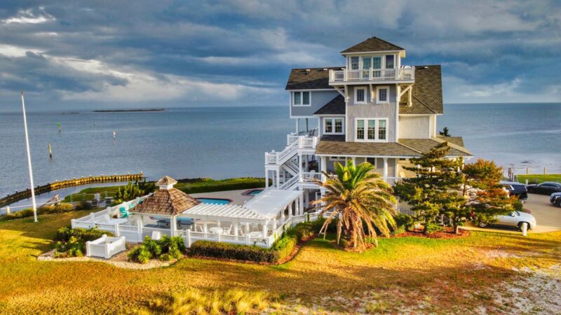 a house on a hill by the water