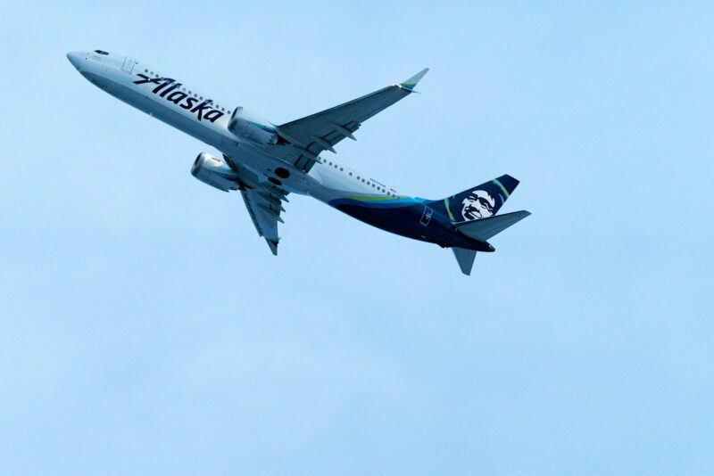 a large passenger jet flying through a blue sky