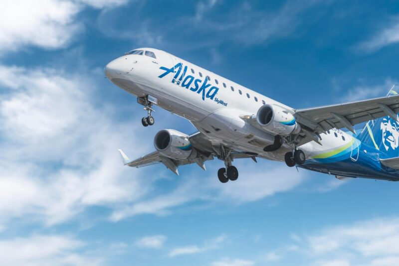 white and blue passenger plane under blue sky during daytime