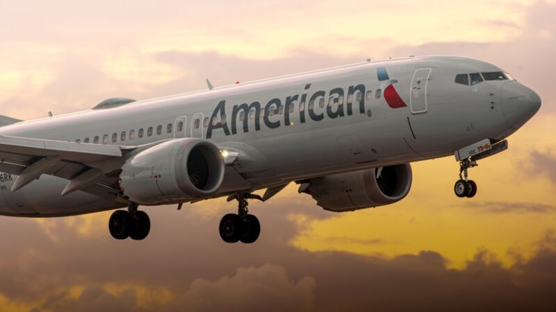 a large passenger jet flying through a cloudy sky