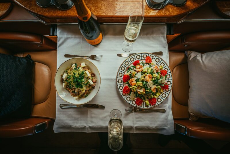 a table with plates of food and glasses on it