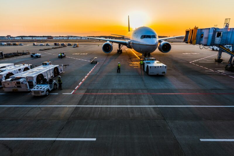 gray airplane on parking, airport security